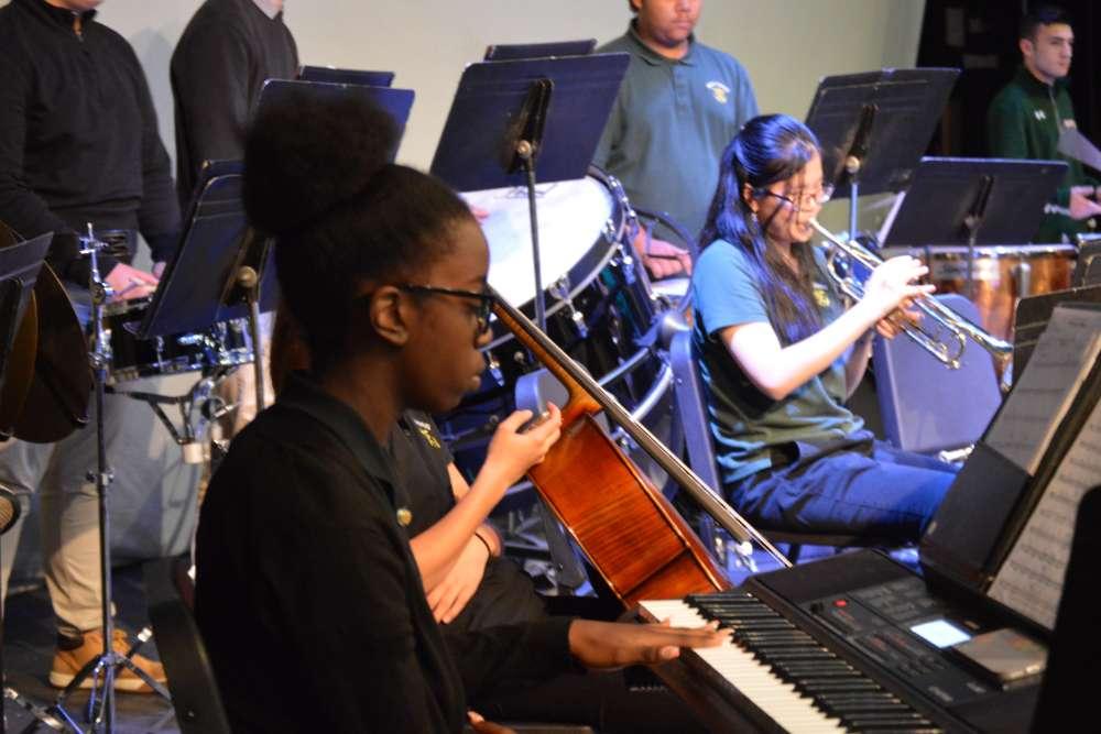 students playing piano and trumpet