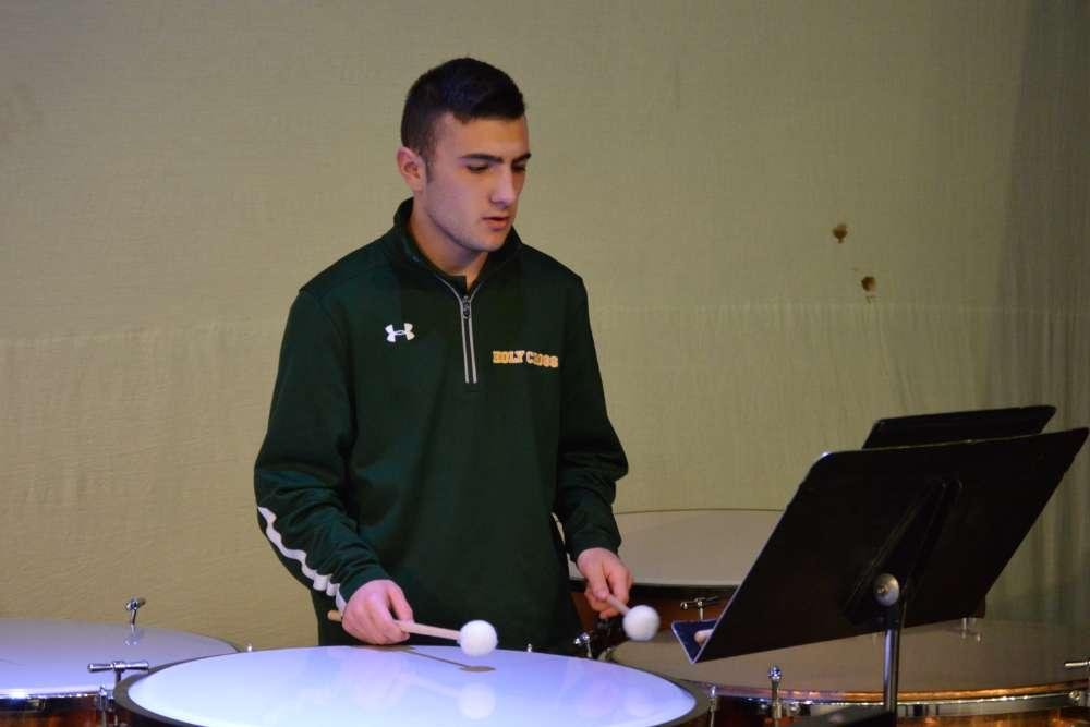 student playing drums