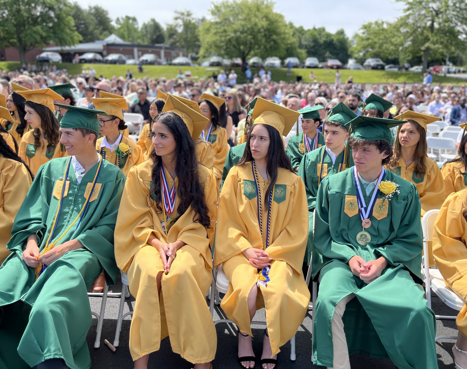 male and female students walking in hallway