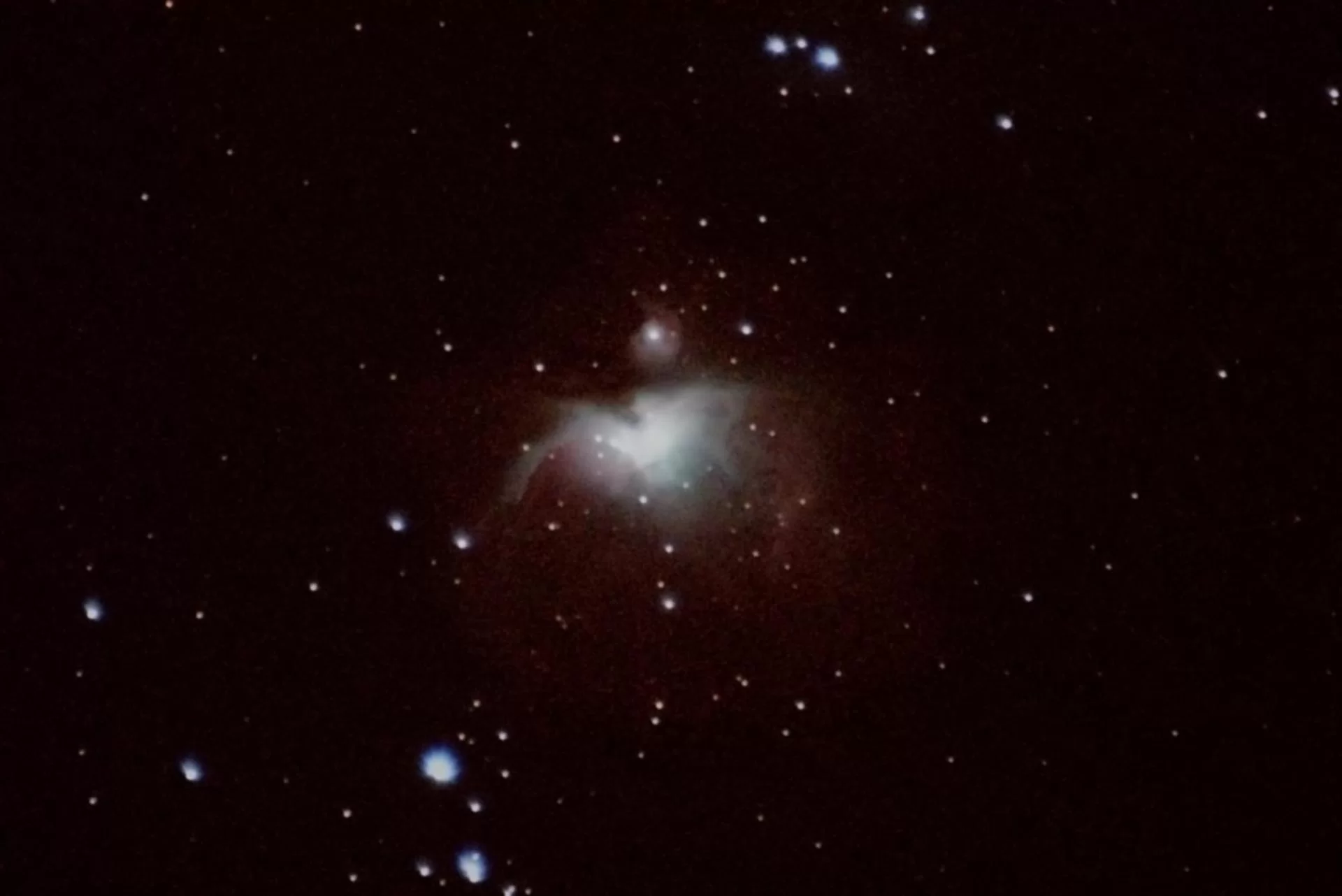 Figure 1 | The Great Orion Nebula. Located in the constellation of Orion (in the sheath of his sword—for reference, see Figure 2), this famous nebula was photographed on 1/16/2021 from Flanders, NJ, using a Canon EOS RP with a Sigma EX DG OS 70-200mm f/2.8 lens and a 2x Sigma APO Teleconverter at f/5.6, and ISO 40,000. The rig was cropped in-camera at 1.6x for a total raw focal length of 640mm. 27x1s images were integrated within DeepSkyStacker and edited in Adobe Photoshop CC v. 22.1.1. The imaging rig was not tracked to a sidereal rate (plain-old tripod! See Figure 3!). 