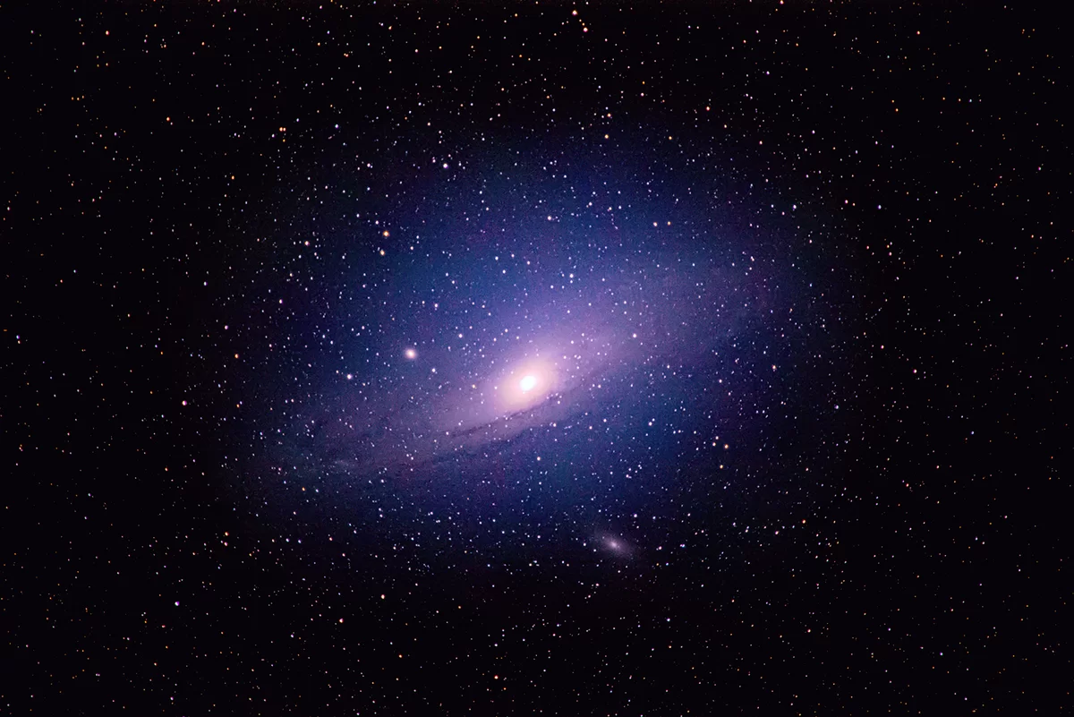 Figure 14 | The Andromeda Galaxy (M31). Photographed on 8/24/2021 from Flanders, NJ, using a Canon EOS RP with a Sigma 150-600mm DG OS HSM f/5-6.3 lens at f/6.3, and ISO 400 on a Sky-Watcher Star Adventurer 2i Pro tracking at sidereal rate. The rig was used in full-frame mode for a total raw focal length of 600mm. 24x120s images were integrated within Sequator for a total of 48 min of data; the output TIFF was then stretched in Adobe Photoshop CC v. 22.1.1 using the Astronomy Tools Action Set (v. 1.6.2 from ProDigital Software) and AstroFlat Pro (v. 1.4.11 from ProDigital Software). 