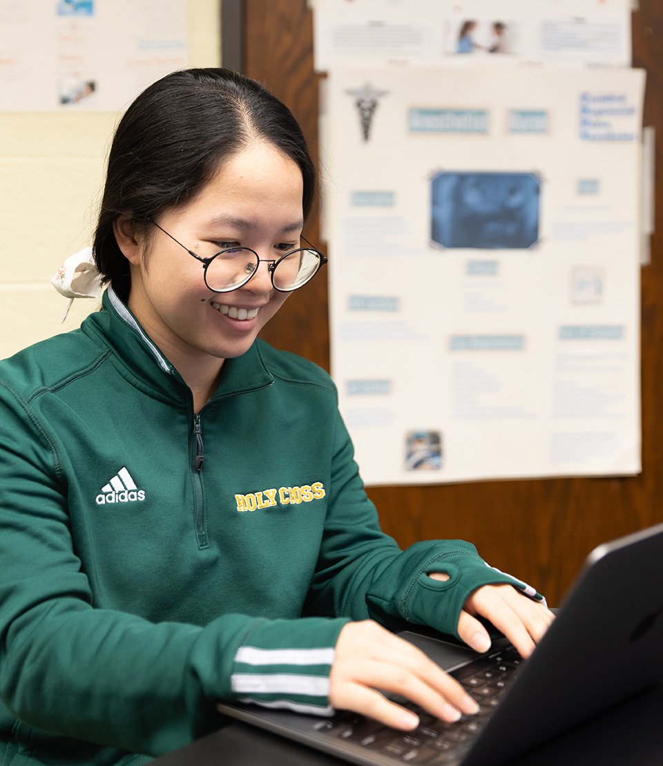 male student working at desk